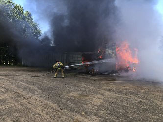 The first line is put in place on the firefighting efforts on the fully involved barn. Photo courtesy of Clark-Cowlitz Fire Rescue