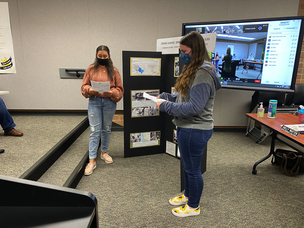 Pleasant Valley Middle School eighth graders Lilly Roman-Myers (left) and Kaylie O'Lear give their Washington State National History Day presentation to the Battle Ground School Board on May 24. Photo courtesy of Battle Ground Public Schools