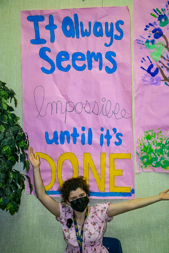 Prairie High School senior Hannah Hollenbeak poses under a poster she made as part of Inspire Week at the school. Photo courtesy of Battle Ground Public Schools