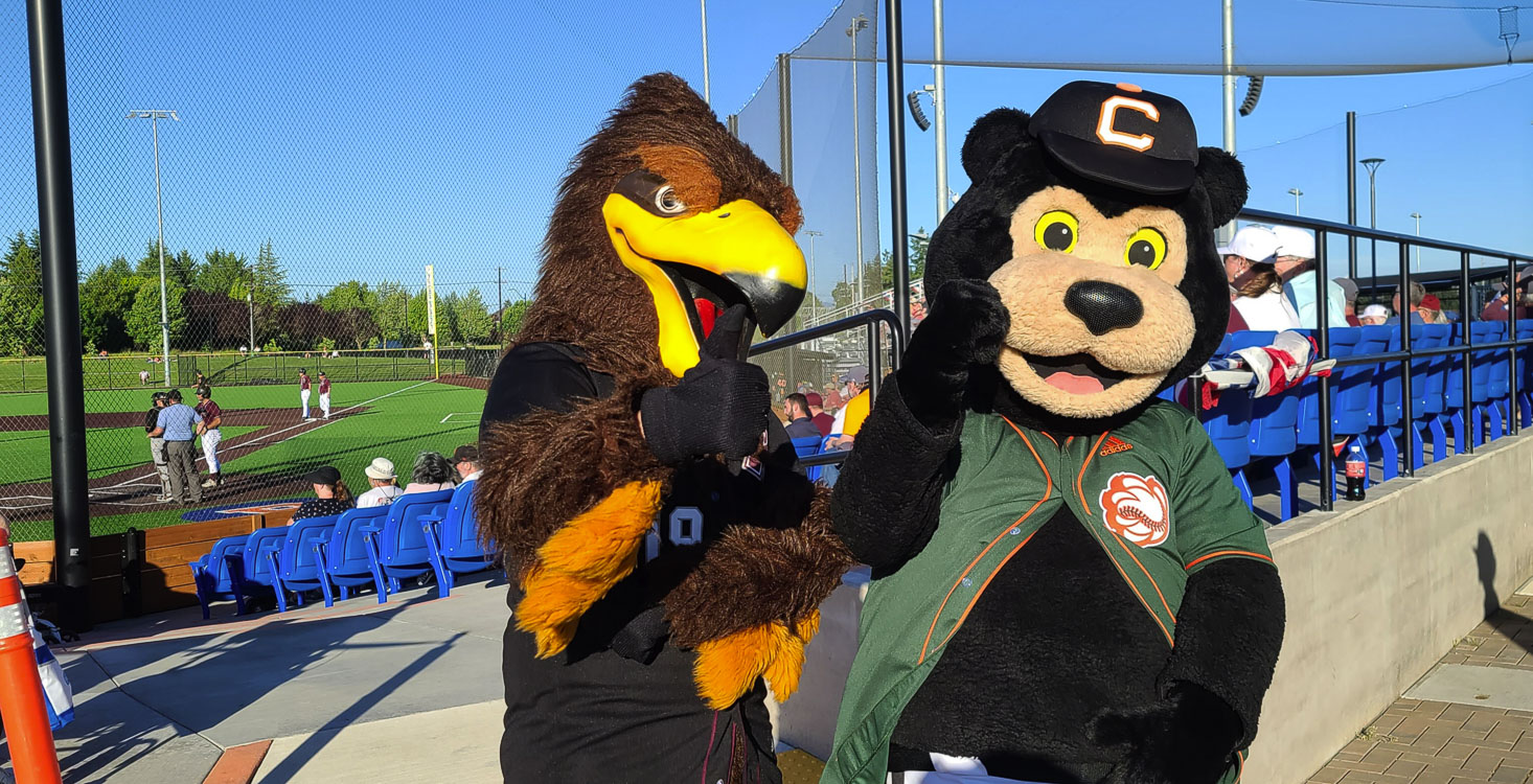 Rally the Raptor and Corby the Bear are friendly rivals. Corby, though, got the last laugh Wednesday. The Cowlitz Black Bears beat the Ridgefield Raptors in the opener for both squads. Photo by Paul Valencia