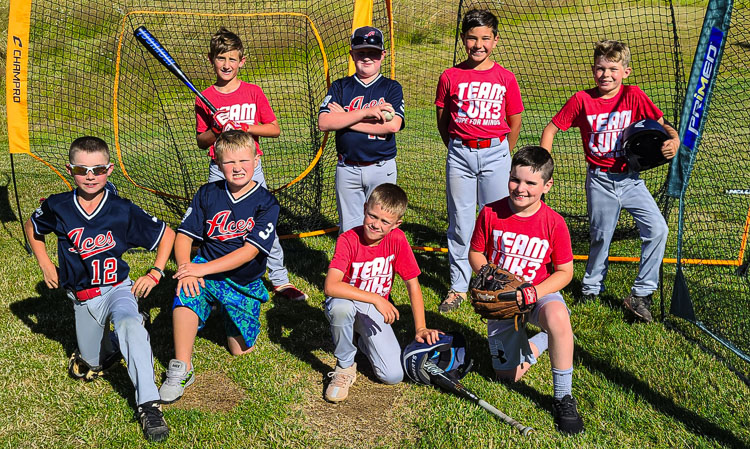 Some members of the Aces, a 9U tournament baseball team, pose in their Aces uniform while others have the Team Luke jerseys. The Aces have raised close to $30,000 for the Team Luke Hope for Minds charity and will hold a Hit-a-Thon on Saturday. They will then donate their money to Tim Siegel and his son Luke, who are coming from Texas to the Ridgefield Raptors game on Saturday night. Photo by Paul Valencia