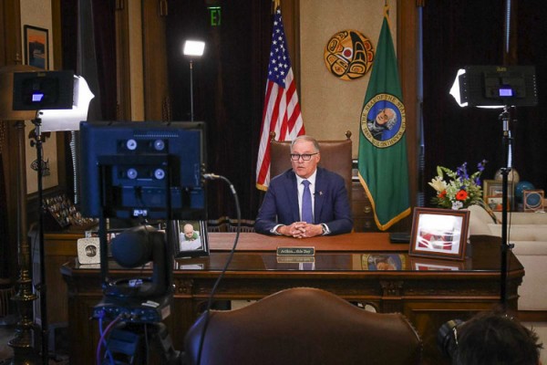 Gov. Jay Inslee is once again asking Washington residents to wear a mask indoors in counties with high transmission rates, although he stopped short Wednesday of announcing a mandate.