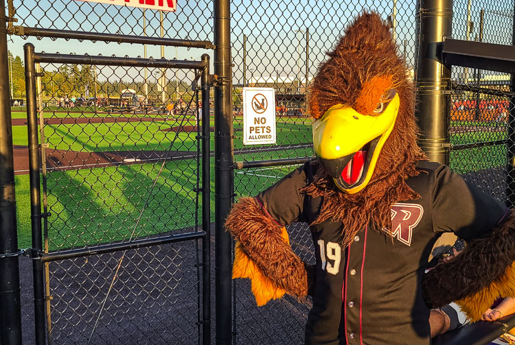 Sign says no pets allowed, but Rally the Raptor is no pet. Rally is the ambassador for the Ridgefield Raptors baseball team, and an actor and student from Mountain View High School brings Rally to life at every home game. Photo by Paul Valencia