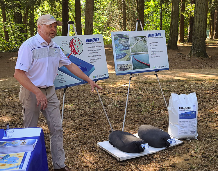 Scott Shuler of EutroPHIX shows a couple of the filtration system units of a new product called EutroSORB, which absorbs phosphorus. Vancouver Lake has too much phosphorus, which creates toxic algae. Photo by Paul Valencia