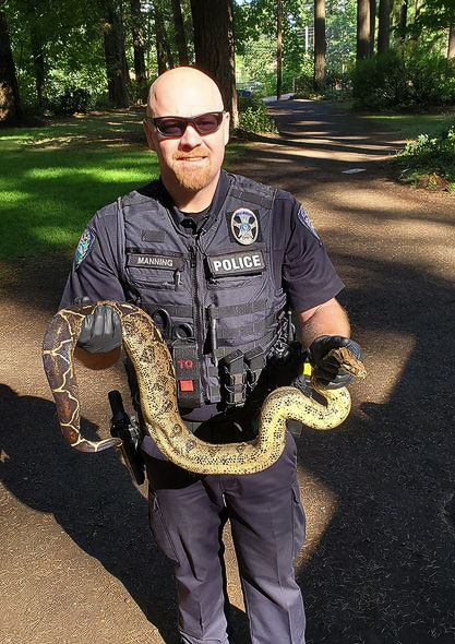 Camas Police Officer Gary Manning shows one of the sneakers recovered at Lacamas Park. Photo courtesy of Camas Police Department