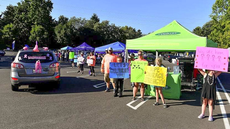 Volunteers for the American Cancer Society’s annual Relay for Life of Clark County came together for a “Party in the Parking Lot -- Tailgate event” at the Vancouver Mall on July 17. The event has raised funds for cancer research and patient services for the American Cancer Society for the past 35 years in Clark County. Photo courtesy of Ken Waz