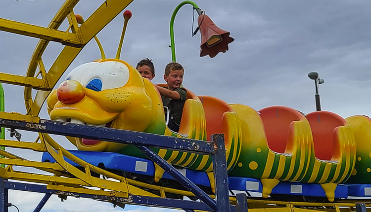 Walker Schlappi (left) and Weston Schlappi got in the front row of the Wacky Worm ride at the Clark County Fairgrounds on Friday. Photo by Paul Valencia