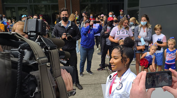 Jordan Chiles takes a moment to address media members as her fans line up behind her during a meet-and-greet with the Olympian from Vancouver. Photo by Paul Valencia