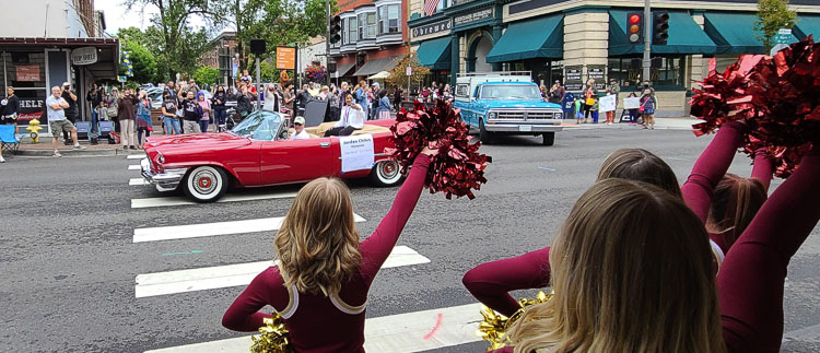Jordan Chiles waves to the Prairie High School cheerleading squad during the parade through downtown Vancouver on Sunday. Chiles, a U.S. Olympian and silver medalist, is a Prairie High School graduate. Photo by Paul Valencia