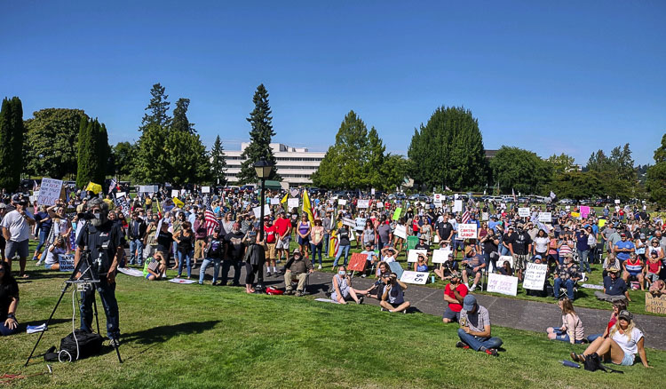 The crowd spread far and wide to hear their fellow citizens express their opposition to Governor Inslee’s vaccine mandate. “This is a pro-consent rally,” stated Rep. Jim Walsh as the final speaker at the event. Photo by Glen Morgan