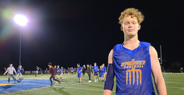 Matthew Lewis, now a senior, was a freshman the first time the Ridgefield Spudders held a midnight practice. He said it is a tradition now for Ridgefield to start its season the first minute possible, just after midnight on the first day of practice. Photo by Paul Valencia