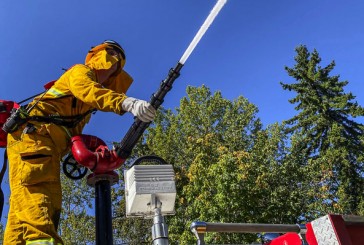 Fast-moving brush fire threatens million dollar homes