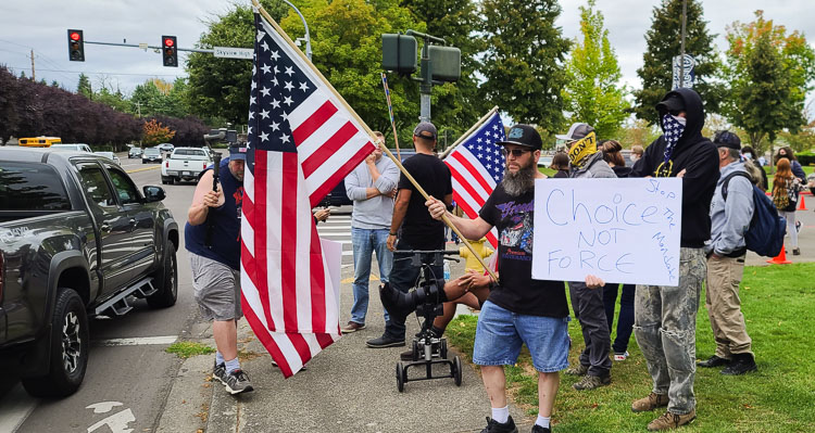 About 30 protestors showed up at Skyview High School Friday afternoon in defiance of a Clark County Superior Court judge’s decision earlier this week to grant the Vancouver School District’s request for an injunction near area schools. Photo by Paul Valencia