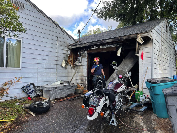 Upon arrival, first arriving fire crews found smoke and fire showing throughout the attached garage. Photo courtesy Vancouver Fire Department