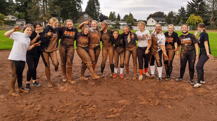 Practicing in the mud? That says it all for the Battle Ground slowpitch softball team, a squad full of tough athletes, according to their coach. Battle Ground has qualified for the Class 4A state tournament. Photo courtesy Rachel Gray