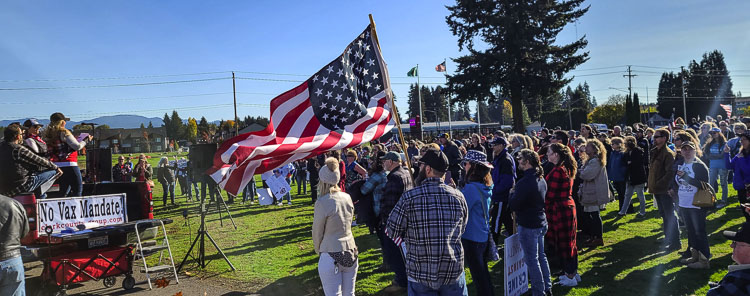 Hundreds of people took part in a no vaccination mandate rally at Faith Center Church on Saturday before lining up at intersections along Highway 503. Photo by Paul Valencia