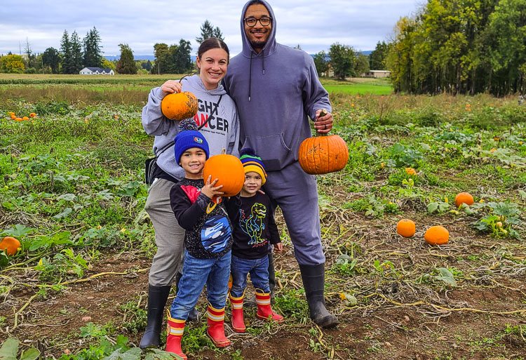 The Coleman family, Meagen, Juston, Jireh, 5, and Jaydon, 2, pick their pumpkins Saturday at The Vancouver Pumpkin Patch at Velvet Acres Gardens. Photo by Paul Valencia