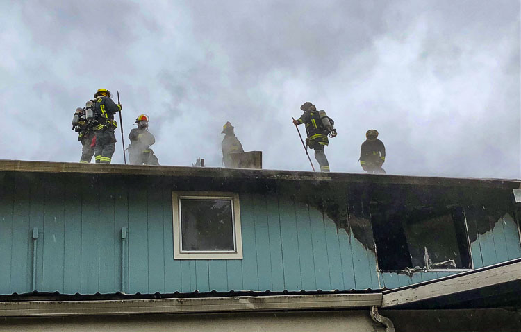 Vancouver Fire crews perform vertical ventilation to remove smoke and heat from the structure. Photo courtesy Vancouver Fire Department
