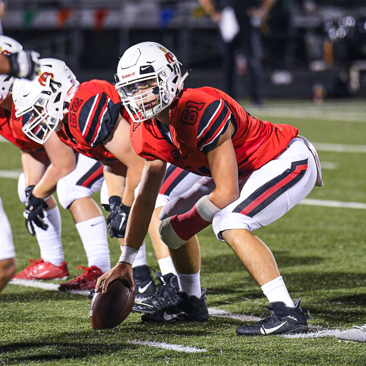 Tyson Jacobson broke his left hand early in the season but did not miss any action, playing center for the Camas Papermakers. Photo courtesy Kris Cavin