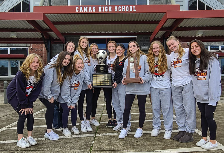 For many of the athletes on the Camas girls soccer team, winning the state championship did not feel real until they brought the trophy home to Camas High School on Monday. Photo by Paul Valencia