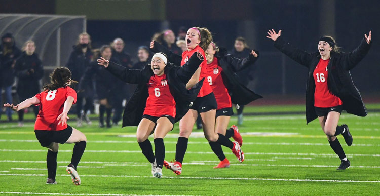 The Camas Papermakers race out to greet Nora Melcher (No. 8) who had just converted on her penalty kick to secure the state championship. Photo courtesy Kris Cavin