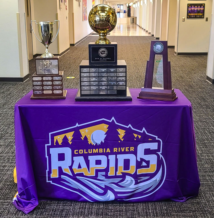The state trophies were placed near the front entrance of the school, for students and staff to celebrate the Columbia River volleyball team. The squad became the first team to win a state title for Columbia River since becoming the Rapids. Photo by Paul Valencia