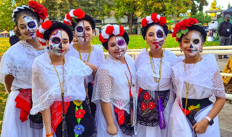 Some of the faces of the Day of the Dead celebration Saturday night. Photo by Paul Valencia