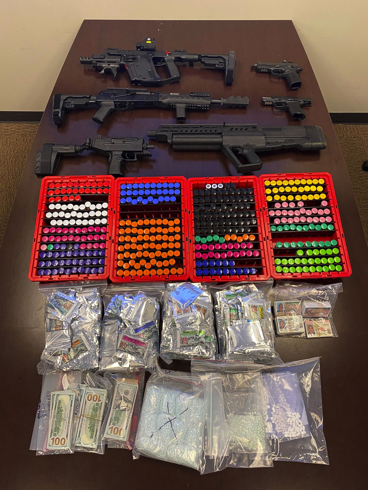 Detectives seized six firearms, approximately 11,000 counterfeit Oxycodone pills, suspected of containing fentanyl, worth an estimated $111,000; a large quantity of steroids and other pills packaged for distribution, worth an estimated $35,000; $32,000 in cash. Photo courtesy Clark County Sheriff’s Office