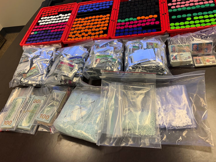 Detectives seized six firearms, approximately 11,000 counterfeit Oxycodone pills, suspected of containing fentanyl, worth an estimated $111,000; a large quantity of steroids and other pills packaged for distribution, worth an estimated $35,000; $32,000 in cash. Photo courtesy Clark County Sheriff’s Office