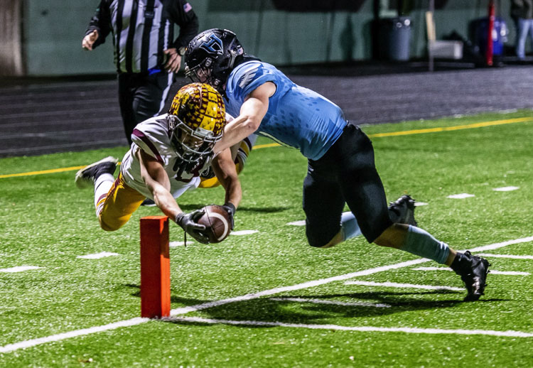 Enumclaw’s Dylan Watterson got the ball into the end zone before going out of bounds for a touchdown just before halftime, giving the Hornets a 24-14 lead over Hockinson. Enumclaw would go on to win 38-28. Photo courtesy Tyler Mode