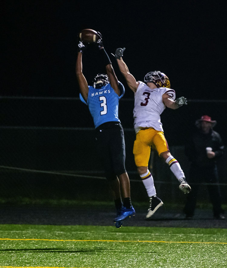 Hockinson receiver Kenyon Johnson jumps to make a touchdown reception Friday night against Enumclaw. Johnson, a senior, had 10 catches for 121 yards and two scores in his final game with the Hawks. Photo courtesy Tyler Mode