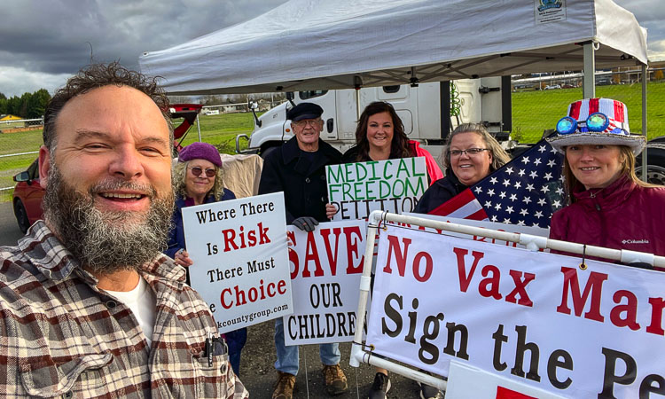 Proponents of a ban on mandates in Clark County that they believe cause discrimination based on someone’s health status, such as vaccination status, are making a final push to gather signatures on a petition by the end of November. Rob Anderson (front left) and other proponents are seen here at one of 25 signature-gathering stations in the area. Photo courtesy Rob Anderson