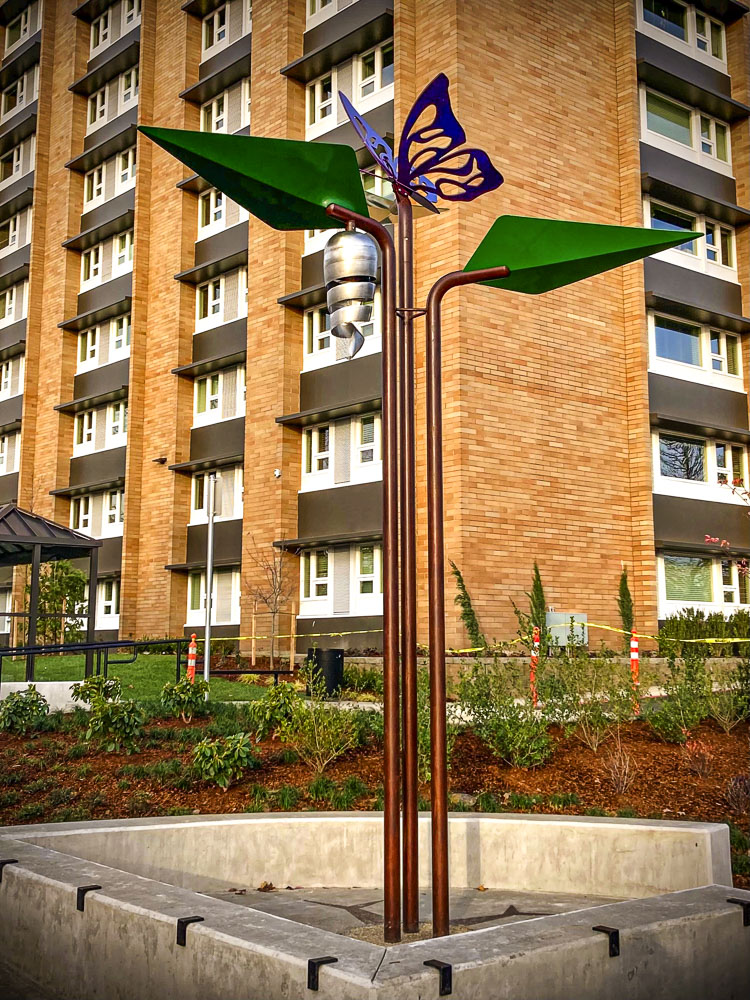 Leaves of Change was installed inside a concrete plaza with seating. Photo courtesy Vancouver Housing Authority