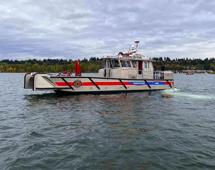 A woman was found clinging to a ladder on a bridge pier Tuesday below the Interstate 5 bridge. Vancouver Fire Boat-1 made an approach from downriver, lowered the front ramp and pulled the citizen to safety. Photo courtesy Vancouver Fire Department