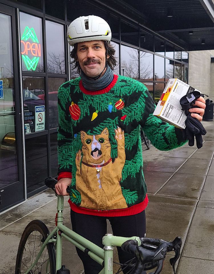 Scott Binkley won the award for ugliest Christmas sweater at the Dialed Cycle Team fun ride on Saturday. The team raises money to buy bicycles for children in need. Photo by Paul Valencia