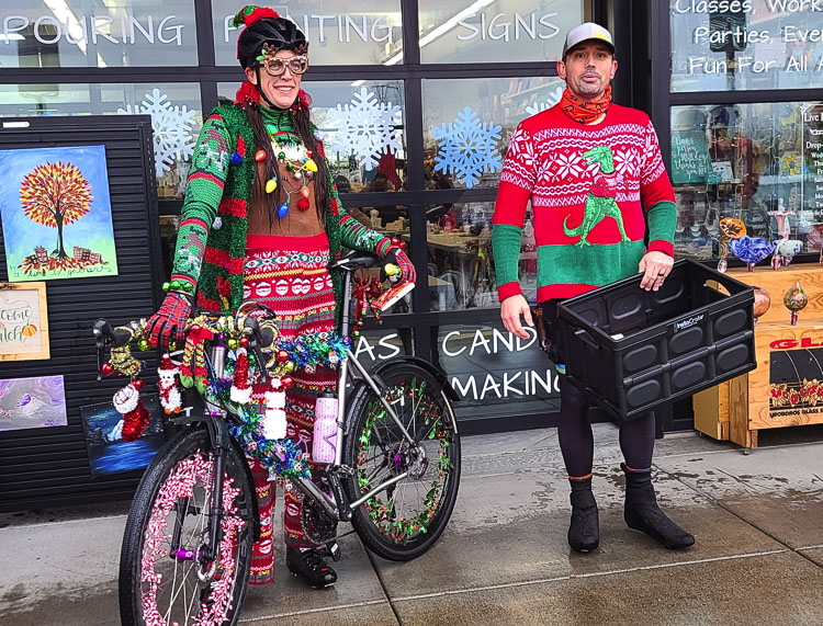 Sonja Ebert “won Christmas” with her holiday display on her bike, according to race organizer Jake von Duering. The Dialed Cycle Team had its Ugly Christmas Sweater fundraiser bicycle ride over the weekend. The team raises money to buy bikes for children. Photo by Paul Valencia