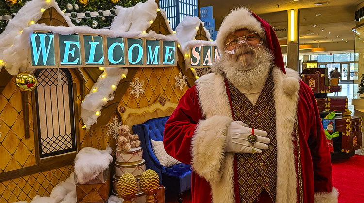 Santa Claus shows off his magic key. Children who live in homes without chimneys often ask Santa how he still visits their home every Christmas Eve. Legend has it, Santa Claus has a magic key. Photo by Paul Valencia