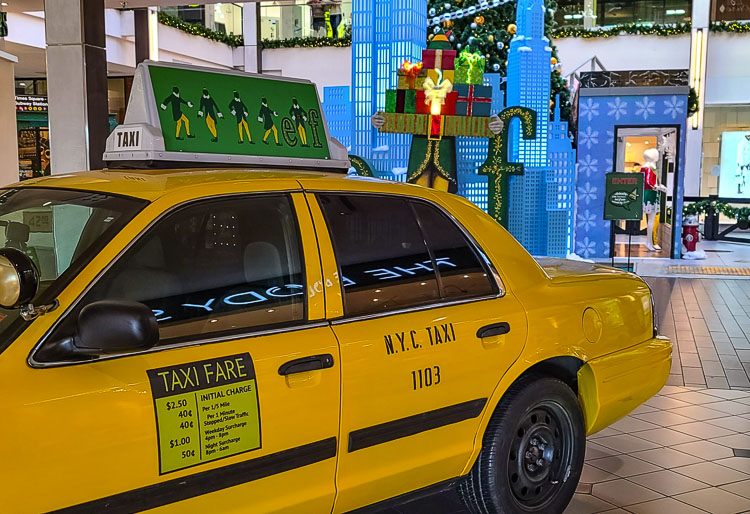 A taxi from New York City just brings more “Elf” magic to the set at the Vancouver Mall. Photo by Paul Valencia