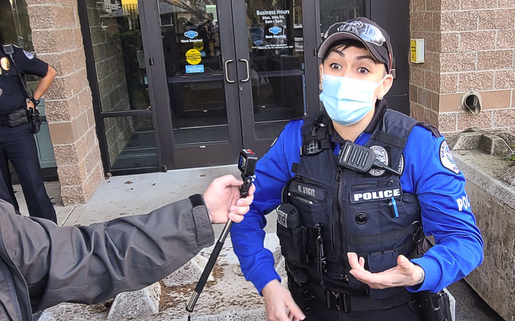 Nicole Vigil of Vancouver Police talks to the media about her first day testing the body cam feature. The city and police department started a 60-day test to determine its next steps. The goal is to have all officers equipped with cameras some time in 2022. Photo by Paul Valencia