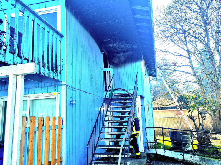 Vancouver firefighters extinguish apartment fire in the Harney Heights