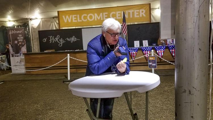 Because of feedback from loudspeakers, citizens went to the back of the tent, when offering their two minutes of testimony to the council. This gentleman received a cheer from the audience following his remarks. Photo by John Ley