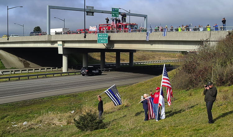 A few folks wanted to get a different view of the procession for officer Donald Sahota. Photo by Paul Valencia