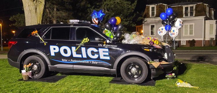 Donald Sahota’s police vehicle is being used as a memorial for the officer. Photo by Paul Valencia