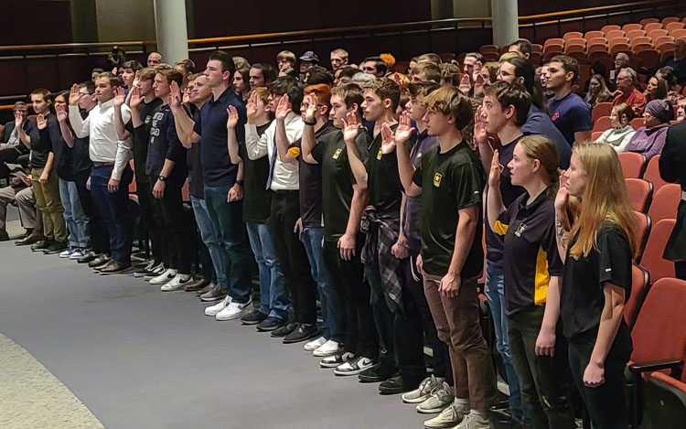 High school seniors from the region who are joining the military after graduation gave their ceremonial oaths of enlistment Wednesday at an “Our Community Salutes” event at Skyview High School. Photo by Paul Valencia