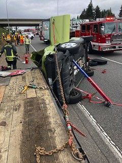 Vehicle crashed into a flatbed trailer that WSDOT crews were using to do work along the freeway