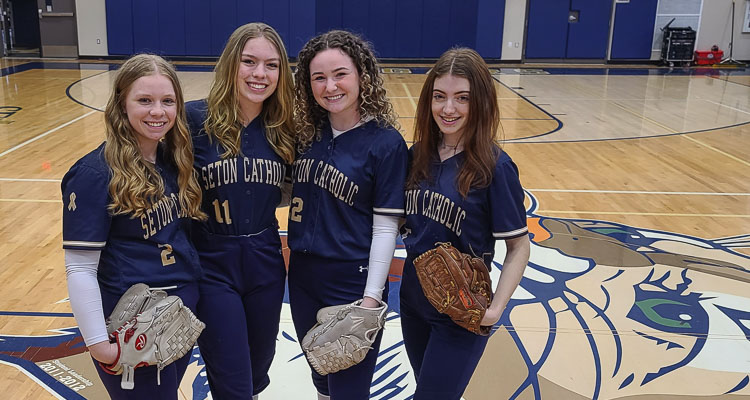 Kaitlyn Kutch, Gianna Redman, Kailey Floyd, and Shaelymae Kutch are proud to represent Seton Catholic in softball in the first year of the program’s existence. Katlyn Kutch is a junior and a vocal leader, while the others are the three seniors playing one season with the Cougars. Photo by Paul Valencia