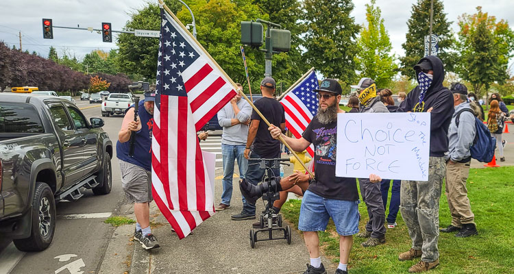 During the current state of emergency, Gov. Jay Inslee’s mandates have led to many protests from conservative residents in the area. These protestors showed up at Skyview High School in September in defiance of a Clark County Superior Court judge’s decision to grant the Vancouver School District’s request for an injunction near area schools. Photo by Paul Valencia