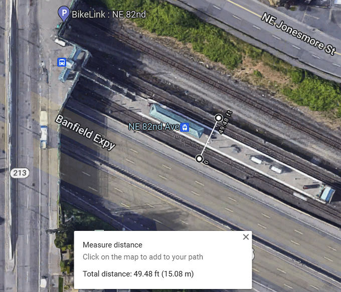 The amount of land required for side-by-side MAX light rail tracks varies. It appears to require 36 to 40 feet for non-station property. But at stations where people need a platform to board, it can be 50 feet or more in width. This shows the 82nd Ave. MAX station in Portland on the north side of I-84. Graphic by John Ley