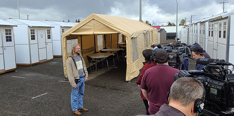 Charles Stuart answers questions from the media on Wednesday at the city of Vancouver’s second Safe Stay Community. Stuart will live in one of the tiny homes and also will be an on-site manager. Photo by Paul Valencia
