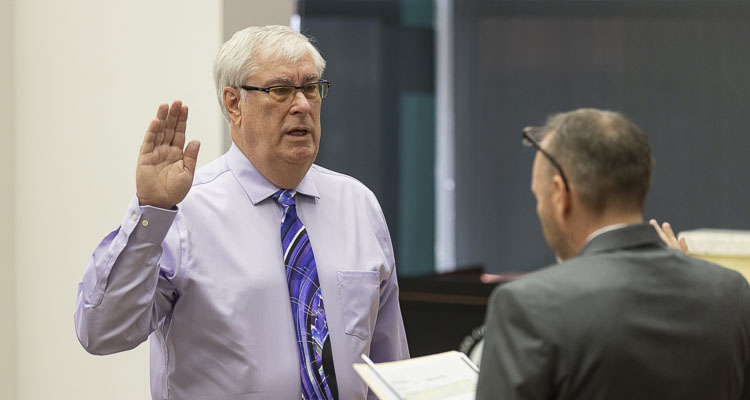 Battle Ground resident Dick Rylander was sworn in to the District 5 seat on the County Council by Clerk Scott Weber Tuesday morning. Photo by Mike Schultz